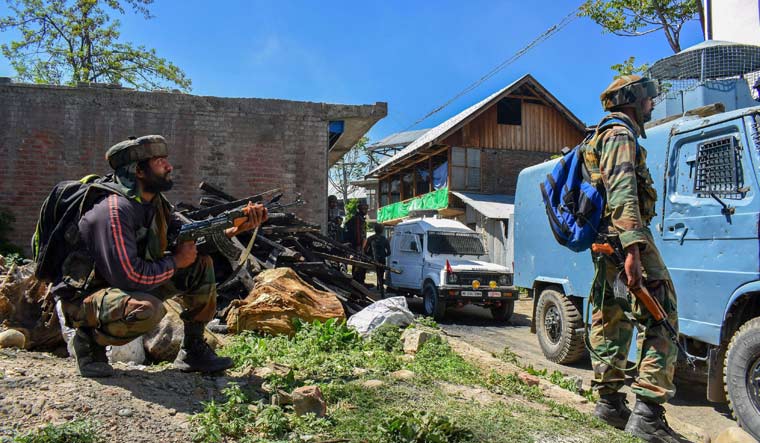 [FILE/Representative image] Security personnel stand guard during an encounter between security forces and militants at Drabgam in Pulwama | PTI