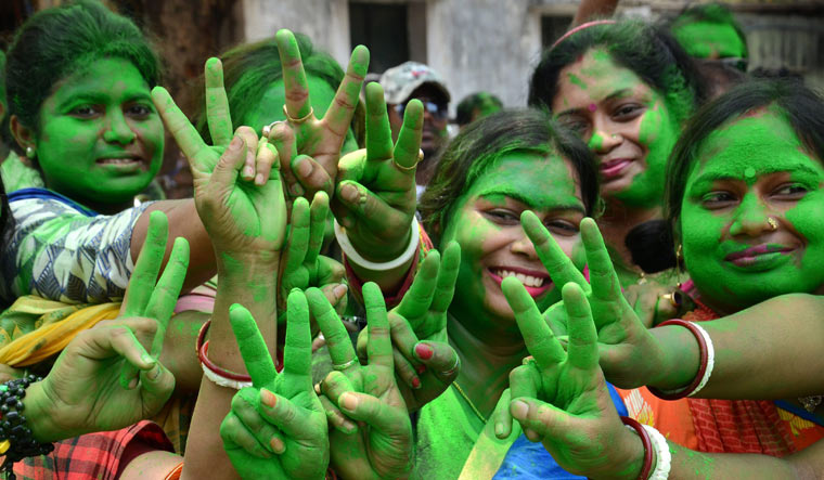 Trinamool Congress supporters celebrate outside a counting station in North 24 Parganas | PTI