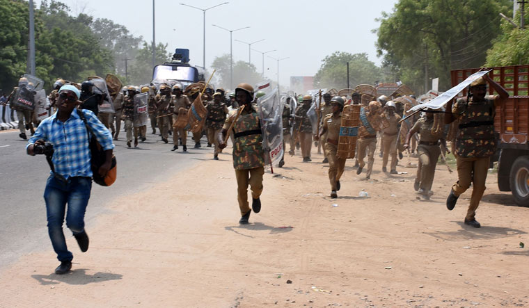 Police charge towards protesters in Thoothukudi during a protest rally held to demand the closure of Sterlite copper smelter plant | AFP