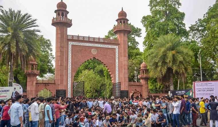 Aligarh Muslim University students protest at the gate of the university campus | PTI