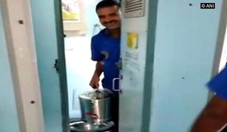 Vendors emerging from toilets with Tea/Coffee cans | ANI