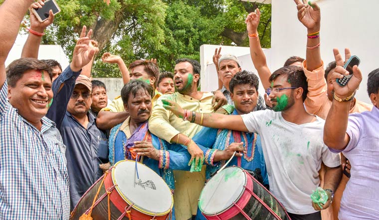 RJD supporters celebrate after their party's victory at Jokihat Assembly by-elections | PTI