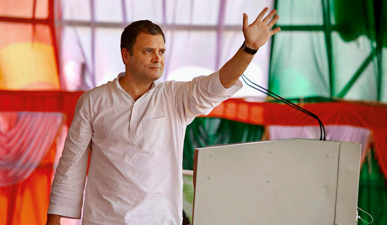 [FILE] Congress President Rahul Gandhi waves during a public meeting ahead of Karnataka Assembly elections at Bheemanna Khandre Institute of Technology Ground in Aurad | PTI