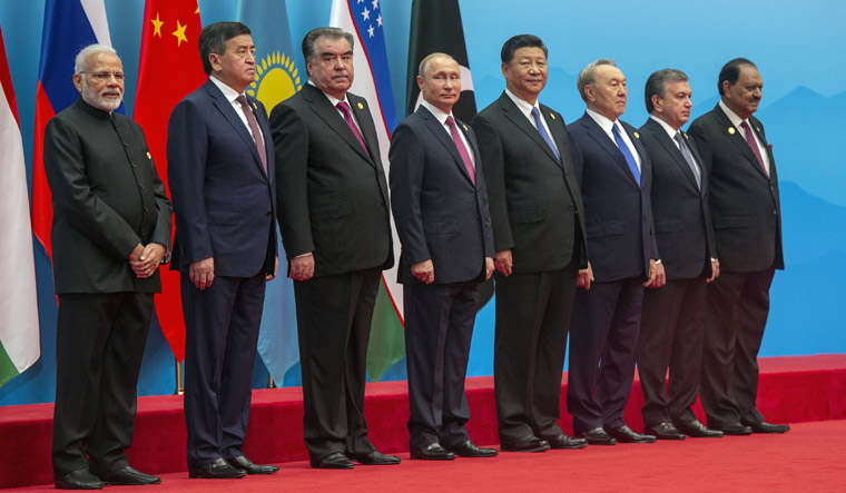Prime Minister Narendra Modi along with other leaders during a photo session of the SCO Heads of State in Qingdao | Reuters