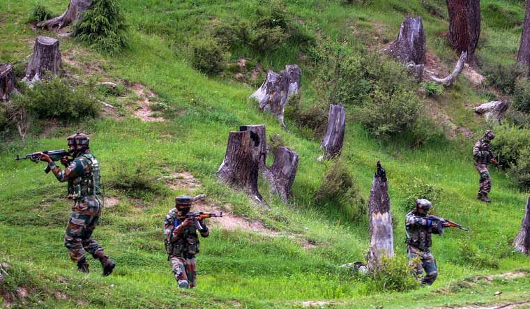 [FILE] Army personnel take positions during an encounter with the militants in Keran Sector of Kupwara district of north Kashmir on Sunday | PTI