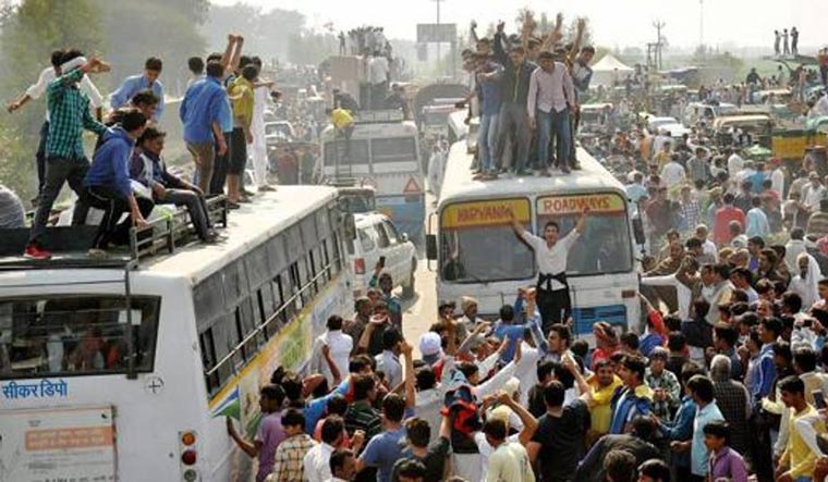 (File) Jat protesters blocking traffic on the Panipat-Rohtak national highway during their agitation for reservation | PTI