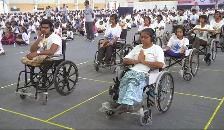 Over 750 differently-abled people wore headphones and were connected through bluetooth device as they exhibited silent yoga | ANI