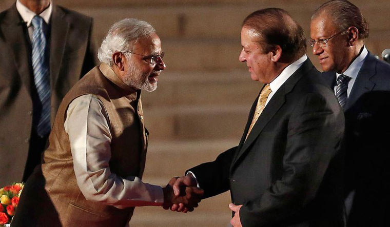 [FILE] Former Pakistan Prime Minister Nawaz Sharif shakes hands with Narendra Modi | Reuters