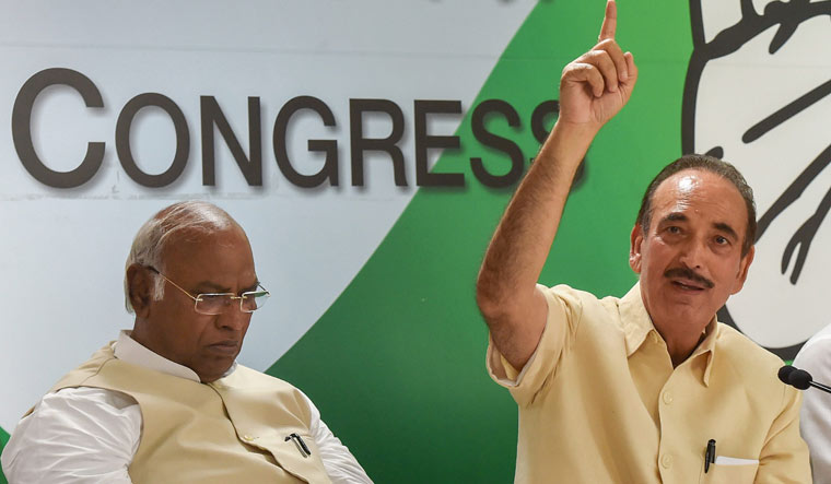 Leader of Opposition in the Rajya Sabha Ghulam Nabi Azad speaks as Congress Parliamentary Party leader Mallikarjun Kharge looks on during a press conference in New Delhi | PTI