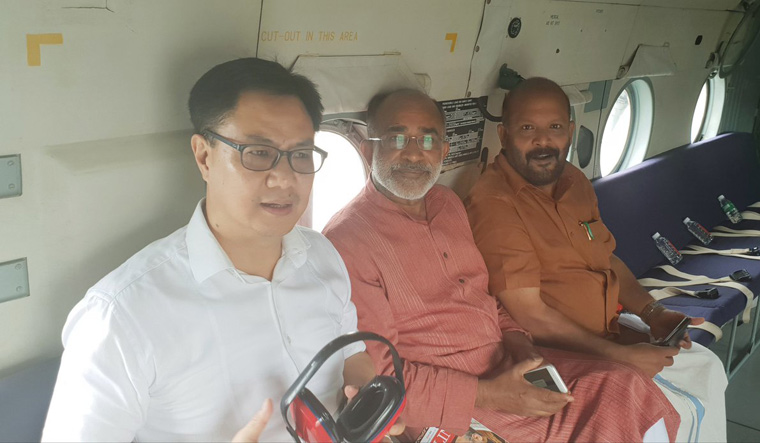 Union Minister of State for Home Kiren Rijiju [left], Union Tourism Minister Alphons Kannanthanam and Kerala Agriculture Minister Sunil Kumar taking stock of the flood situation in Kerala | Courtesy: Kiren Rijiju Twitter