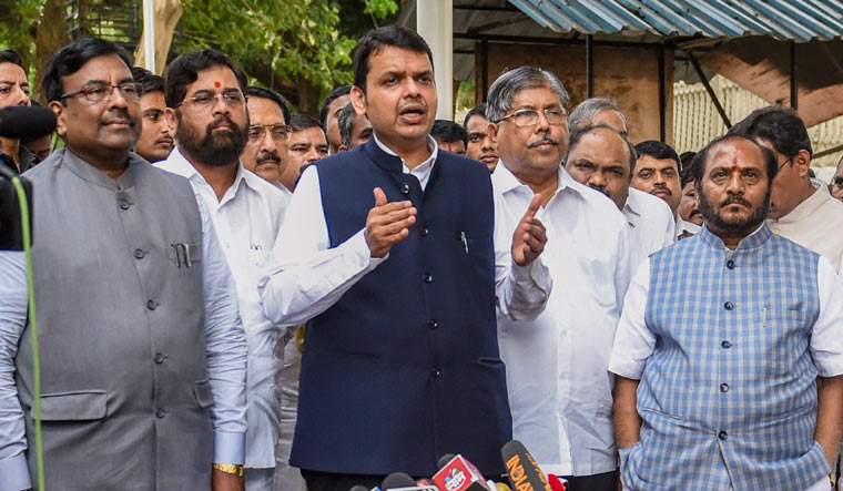 Maharashtra Chief Minister Devendra Fadnavis along with party leaders interact with the media after an all-party meeting to discuss the Maratha reservation issue, in Mumbai on Saturday | PTI