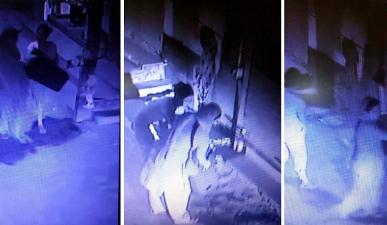 A screengrab from a CCTV camera shows members of the family carrying stools and wires that were allegedly used for hanging | PTI
