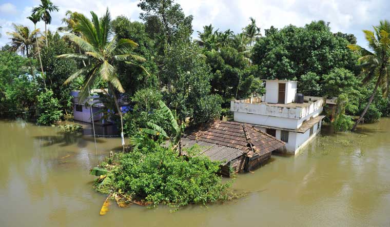 Marooned buildings on the banks of overflowing Pampa river in Alappuzha district | AFP