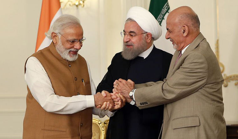 Prime Minister Narendra Modi, Iranian President Hassan Rouhani and Afghan President Ashraf Ghani hold hands in a show of solidarity after their trilateral meeting at the Saadabad Palace in Tehran, Iran, on May 23, 2016