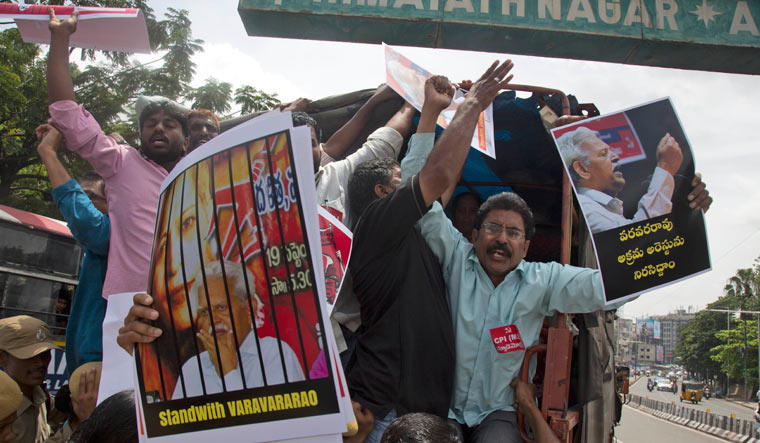 Protesters shout slogans after being detained while demonstrating against the arrest of revolutionary writer Varavara Rao and other activists, in Hyderabad | AP