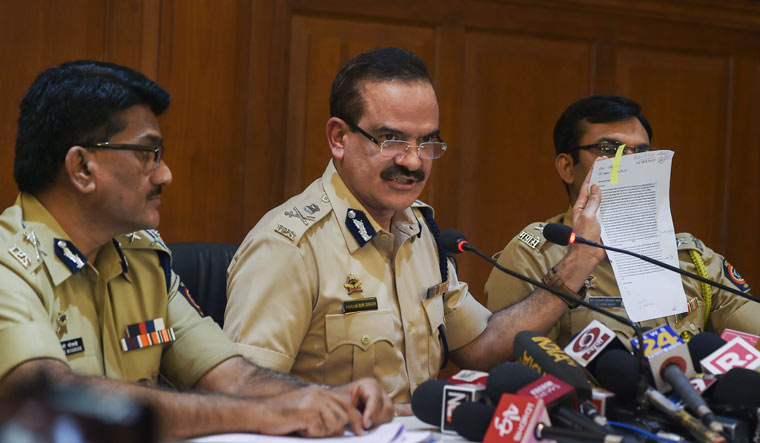 Maharashtra DGP Param Bir Singh, with Pune's Additional CP Shivaji Bodke (L), interacts with the media about the house arrest of rights activists | PTI
