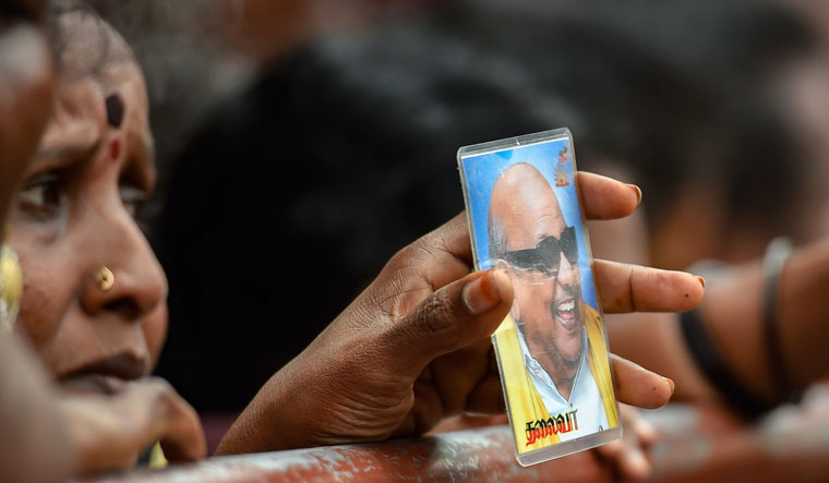A file photo shows DMK supporters gather near the Kauvery Hospital in Chennai where party President M. Karunanidhi was undergoing treatment. Karunanidhi died on August 7, 2018 | PTI