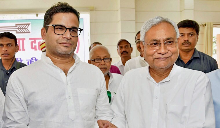 Bihar Chief Minister and Janta Dal United JD(U) National President Nitish Kumar greets electoral strategist Prashant Kishor after he joined JD(U) during party's state executive meeting at Anne Marg, in Patna on Sunday | PTI
