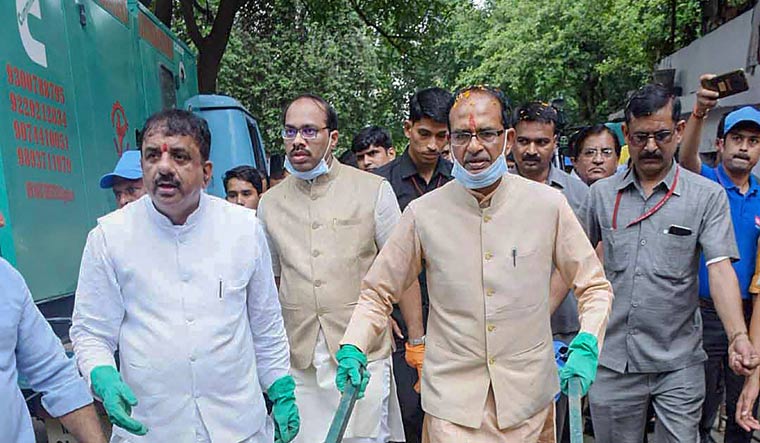 Madhya Pradesh Chief Minister Shivraj Singh Chouhan participates in a cleanliness drive under 'Swacchta hi Sewa' campaign, in Bhopal on Saturday | PTI