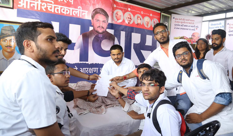 [File] Hardik Patel along with a group of students during a hunger strike in Ahmedabad | PTI