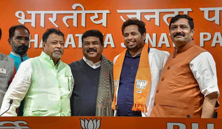 Former Trinamool Congress Lok Sabha MP Soumitra Khan poses for a photograph with Union minister Dharmendra Pradhan and other BJP leaders after joining the BJP at party headquarters in New Delhi on Wednesday | PTI