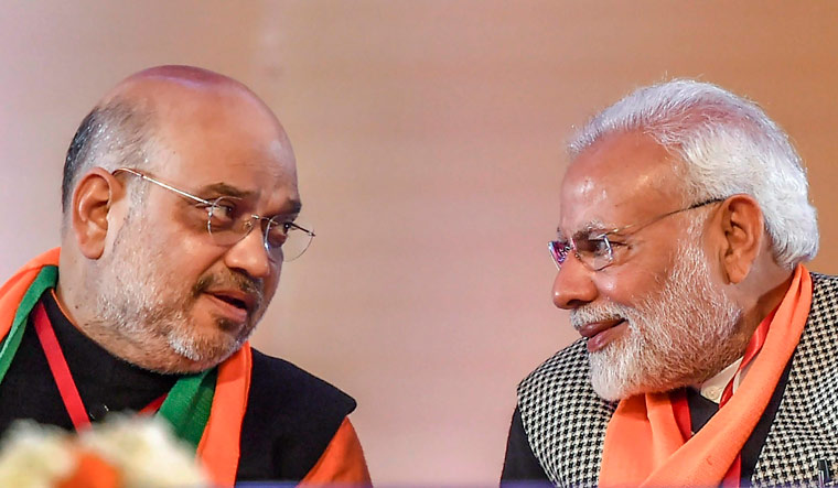 Prime Minister Narendra Modi with BJP president Amit Shah, on the first day of BJP national executive meet, at Ramlila Maidan in New Delhi | PTI