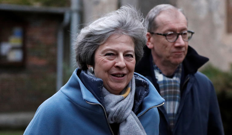 Britain's Prime Minister Theresa May and her husband Philip leave church, near High Wycombe | Reuters