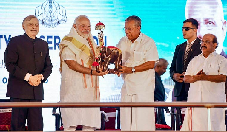 Prime Minister Narendra Modi being felicitated by Chief Minister Pinarayi Vijayan during an event to inaugurate the Kollam bypass | PTI
