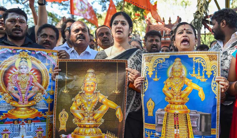 Lord Ayyappa devotees stage a protest against the entry of two women of menstruating age into the Sabarimala temple, in Bengaluru | PTI