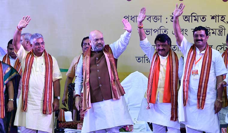 BJP president and Union Home Minister Amit Shah addresses a party rally at Netaji Indoor Stadium in Kolkata | Salil Bera