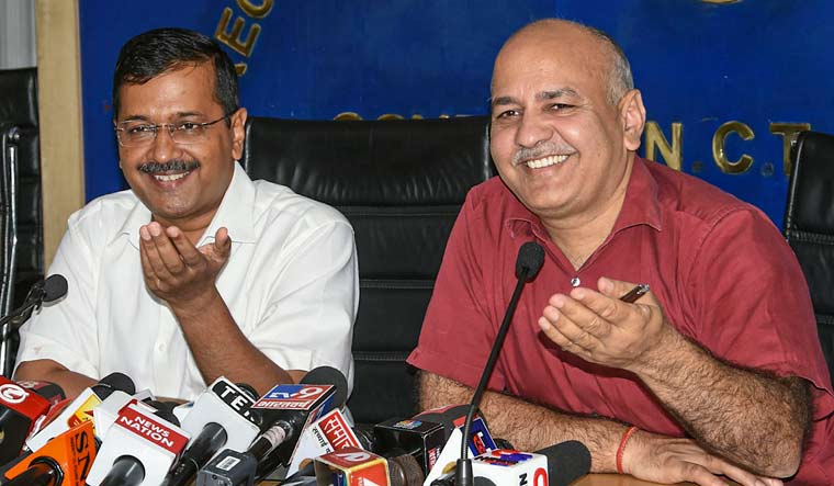 Delhi Chief Minister Arvind Kejriwal with Deputy Chief Minister Manish Sisodia addresses a press conference in New Delhi | PTI