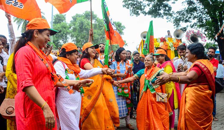 BJP supporters gather during a road show by Maharashtra Chief Minister and party candidate Devendra Fadnavis on the last day of campaigning, in Nagpur | PTI