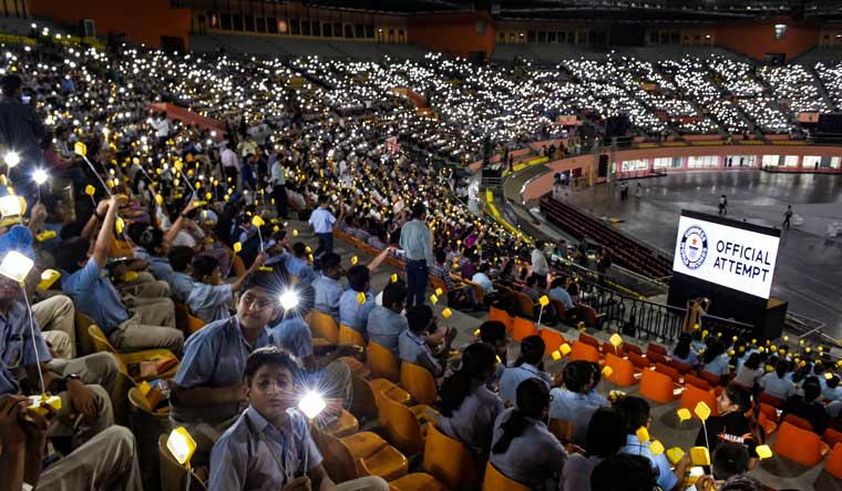 Thousands of students gathered for 'Global Student Solar Assembly' on the occasion of the 150th birth anniversary of Mahatma Gandhi, at Indira Gandhi Indoor Stadium in New Delhi | PTI