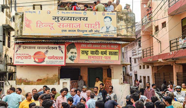 People gather near the office-cum-residence of Hindu Samaj Party founder Kamlesh Tewari in Lucknow | PTI