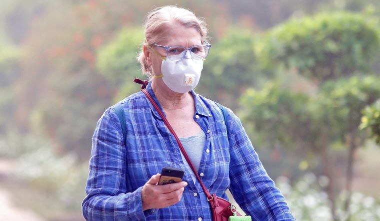 woman-wearing-mask-air-pollution-Delhi-Diwali-Reuters