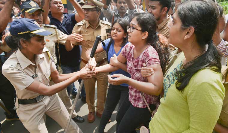 Police detain activists who were staging a protest against the tree-cutting at Aarey Colony in Mumbai | PTI