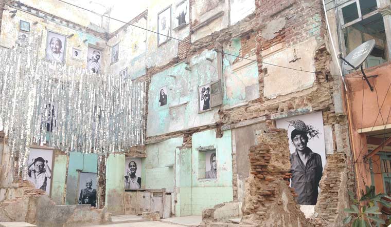 Photographs put up in a collapsed building in Dhal Ni Pol