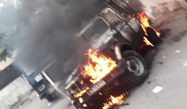 A police vehicle was set on fire during the clash | Twitter/ANI