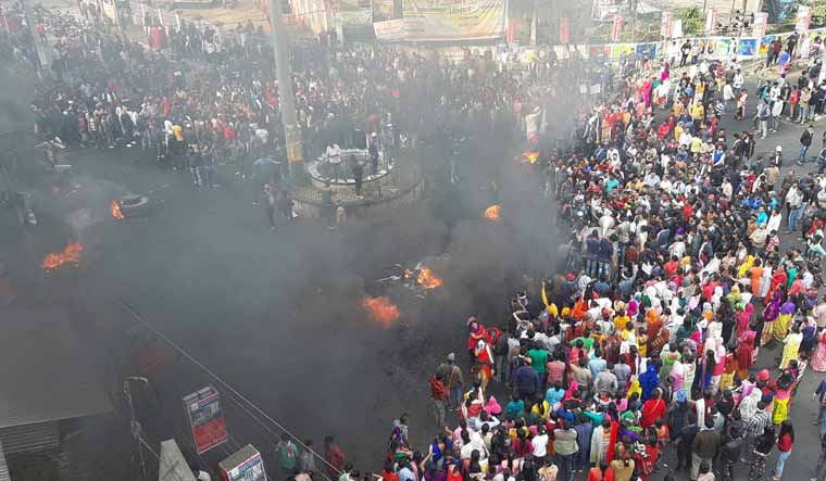 College students along with locals burn tyres during their protest strike against the Citizenship Amendment Bill (CAB), in Tinsukia district of Assam | PTI
