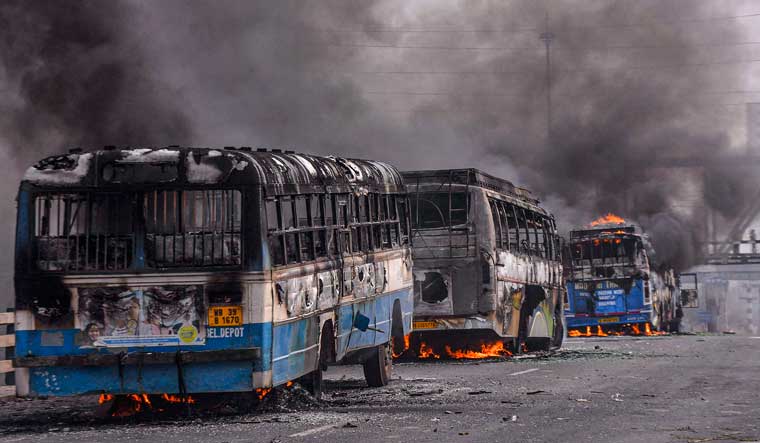  Vehicles torched by protestors agitating against the passing of Citizenship Amendment Bill (CAB) at Sanmtragachi in Howrah | PTI