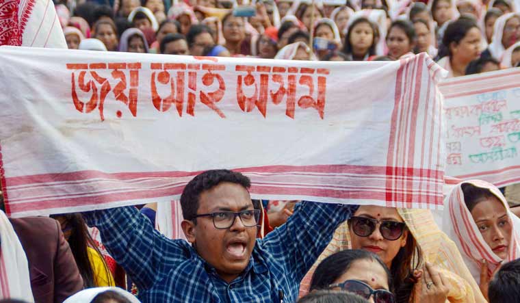 People participate in a protest against the Citizenship Amendment Act (CAA) at Nehrubali in Nagaon, Assam | PTI