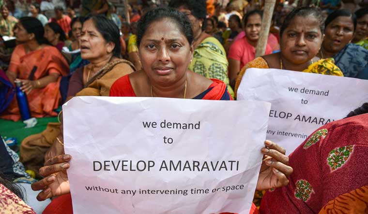 [File] Farmers hold placards as they protest against Andhra Pradesh government's move to shift the state capital from Amaravati, at Thullur village in Guntur on December 20 | PTI