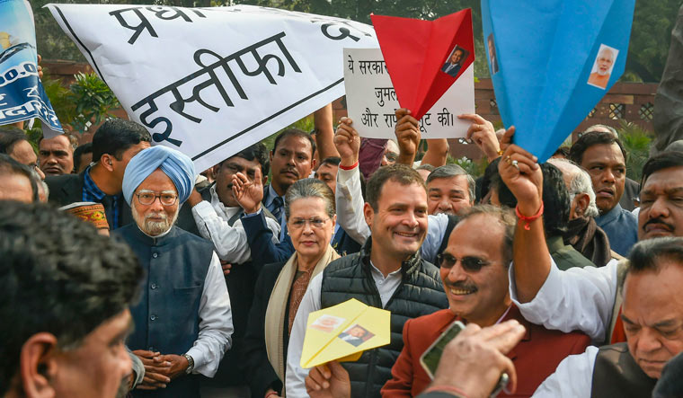 Congress president Rahul Gandhi, former prime minister Manmohan Singh, former party president Sonia Gandhi and other party leaders during a protest over the Rafale deal, near Mahatma Gandhi's statue at Parliament | PTI