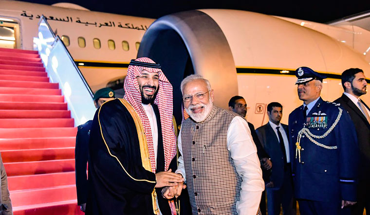 Prime Minister Narendra Modi welcomes Crown Prince of Saudi Arabia Mohammed bin Salman on his arrival at Palam AFS in New Delhi | PTI