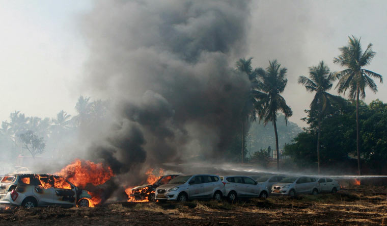 Smoke and flames rising after a major fire broke out in a car parking space opposite to Ramachandra Medical College in Porur, Chennai | PTI