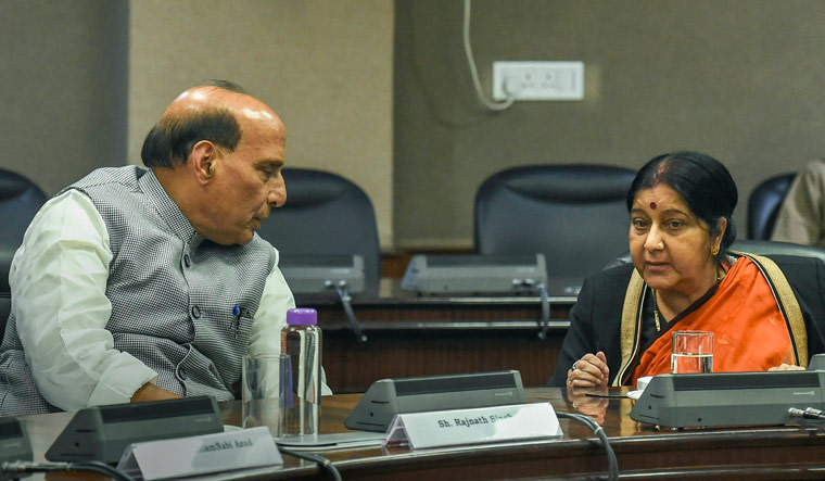 External Affairs Minister Sushma Swaraj interacts with Home Minister Rajnath Singh at an all-party meeting after IAF's pre-dawn strike on JeM camp, at Jawahar Lal Bhawan, in New Delhi | PTI