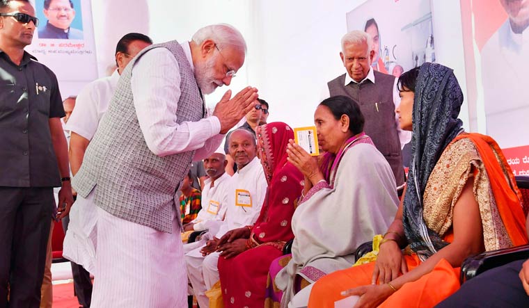 Prime Minister Narendra Modi interacts with beneficiaries of Ayushman Bharat Yojna, in Kalburgi, Karnataka | PTI