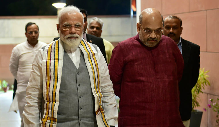 Prime Minister Narendra Modi and BJP president Amit Shah arrive to attend party's Parliamentry Board Meeting over poll preparedness, in New Delhi | PTI