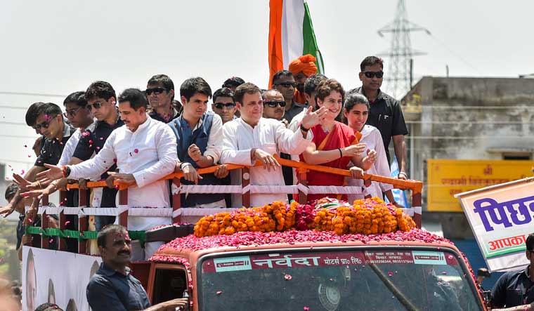 Congress president Rahul Gandhi with his sister and party general secretary Priyanka Gandhi Vadra during a roadshow before filing his nomination papers for Amethi Lok Sabha seat, in Amethi | PTI