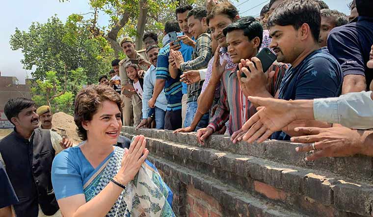 Congress general secretary Priyanka Gandhi Vadra meets her supporters during an election campaign in Fatehpur district of UP | PTI